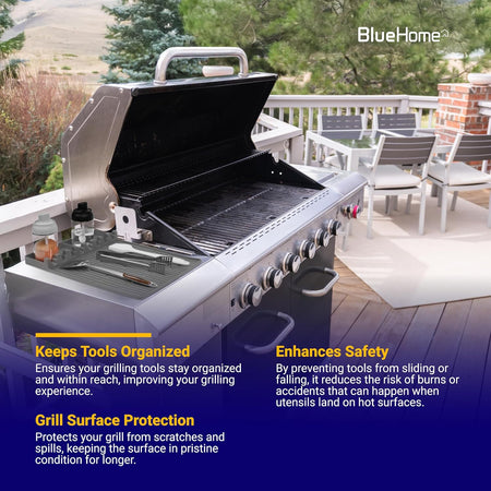 Grey silicone grill mat holding BBQ utensils on the side shelf of an outdoor gas grill.