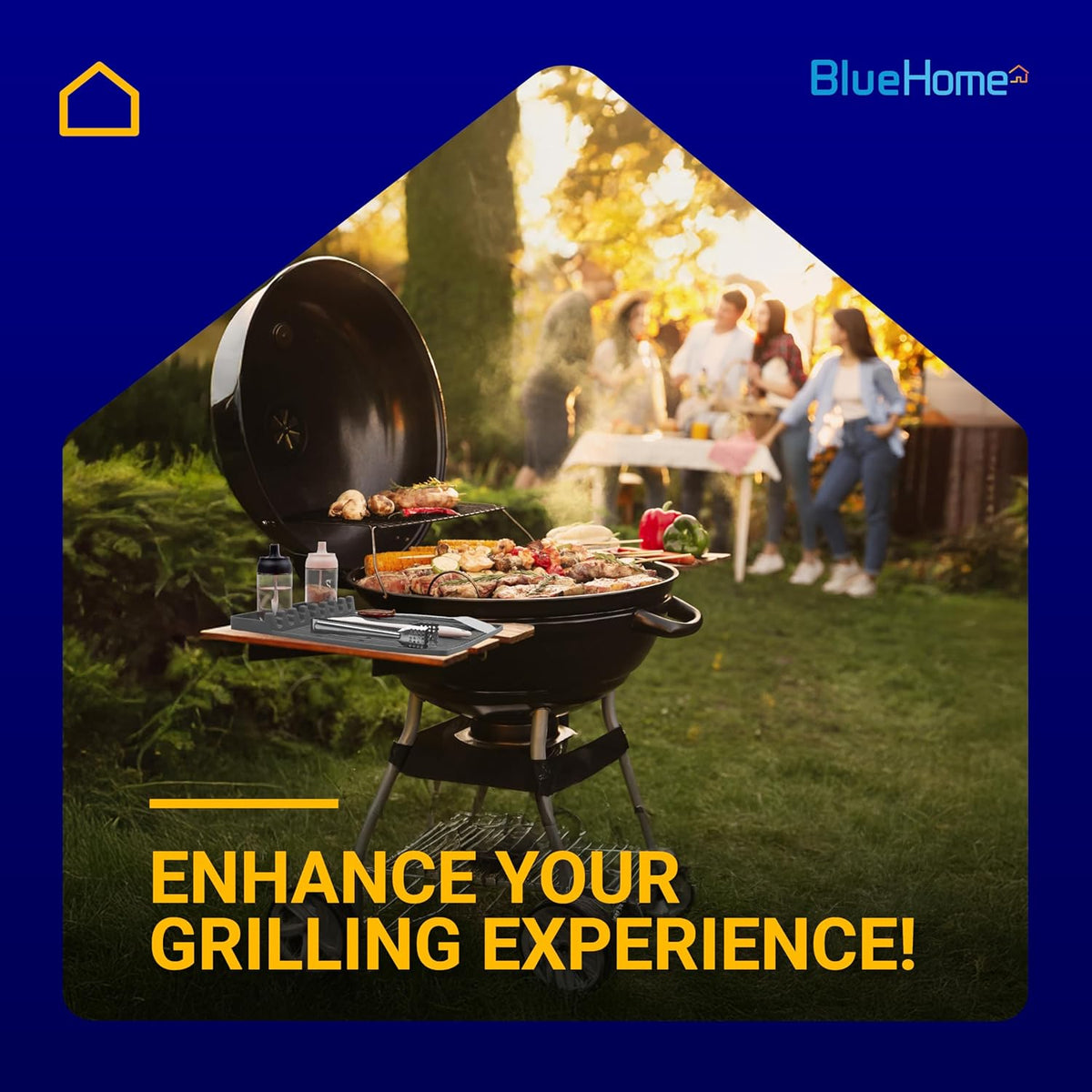 Grey silicone grill mat placed on a side table of a charcoal grill with food and grilling tools.