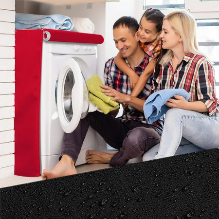 Red premium outdoor cover installed on a front-load washing machine with a family folding laundry nearby.
