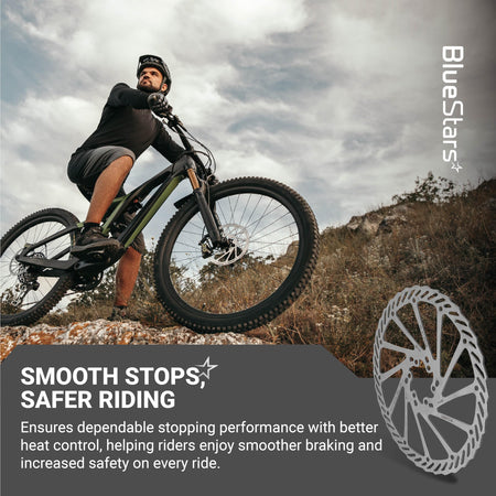 Mountain biker riding on a trail with a 203mm stainless steel disc brake rotor shown in the foreground.