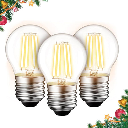 Three G45 E26 Edison LED filament globe bulbs with clear glass and warm light, arranged in a festive holiday frame.