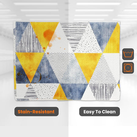 Stain-resistant washer and dryer top cover mat with yellow and blue geometric triangle pattern.