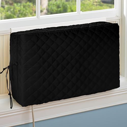 Black quilted indoor window air conditioner cover installed on a unit for winter insulation.