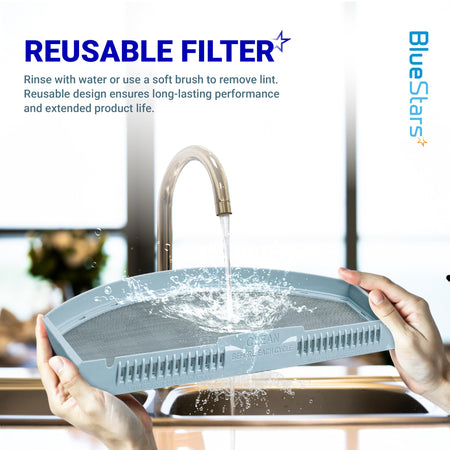 Hands rinsing a WE03X23881 dryer lint filter under a kitchen faucet to demonstrate its reusable design.