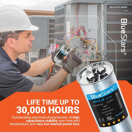 Technician installing a BlueStars 80+5 uF 370/440 VAC dual run round capacitor in an AC condenser unit.