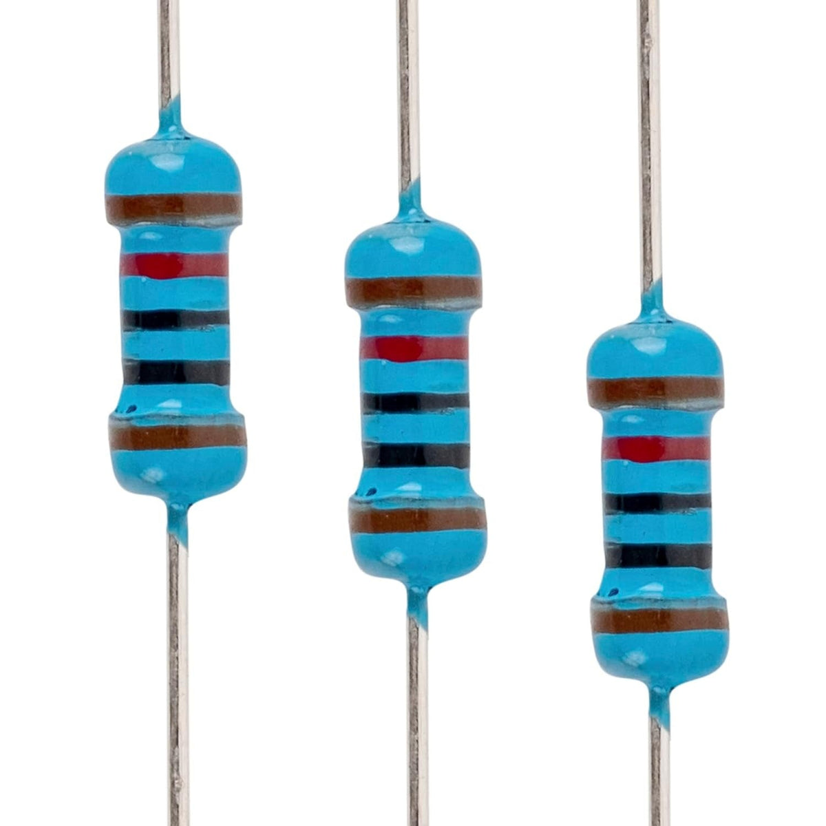 Close-up of three 1/4W 10k ohm metal film resistors with blue bodies and color-coded bands.