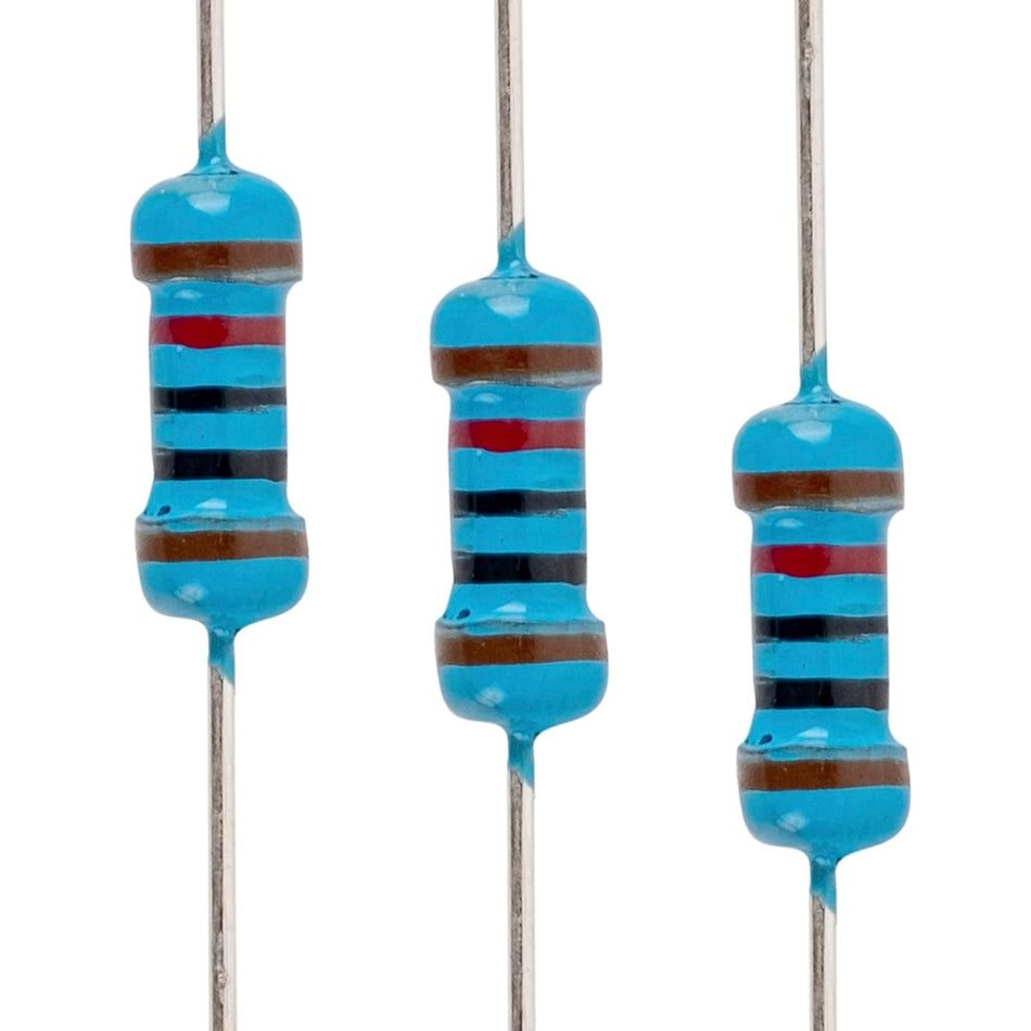 Close-up of three 1/4W 10k ohm metal film resistors with blue bodies and color-coded bands.