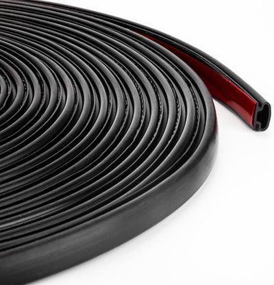 Coiled D-shaped black rubber weather stripping door seal with red adhesive backing.