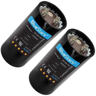Two BlueStars 430-516 uF 220-250 VAC round start capacitors for single-phase electric motors.