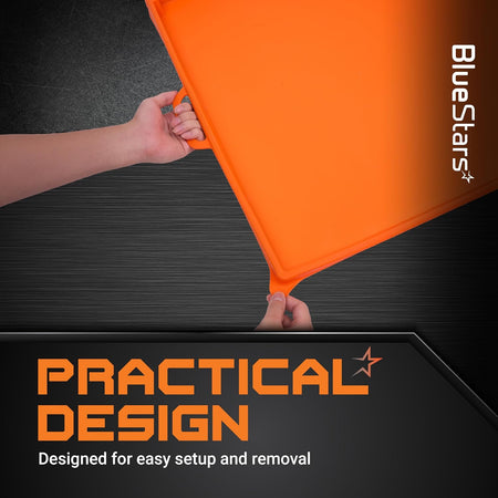 Hands holding an orange 36-inch silicone griddle cover by the integrated handles for easy removal.