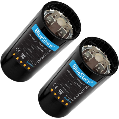 Two BlueStars 340-408 uF 110-125 VAC round start capacitors for single-phase motors.