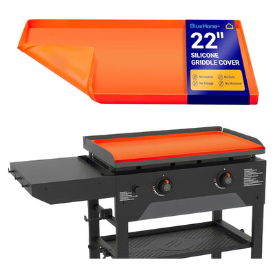 Orange 22-inch silicone griddle mat shown with packaging and installed on a black outdoor griddle.