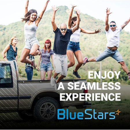 Group of friends jumping near a pickup truck for BlueStars exterior door handle promotion.