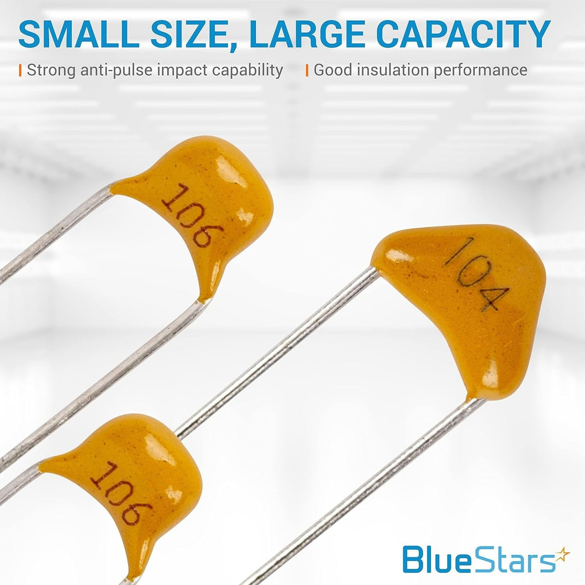 Close-up of three yellow ceramic capacitors labeled 106 and 104 from a 10-value assortment kit.